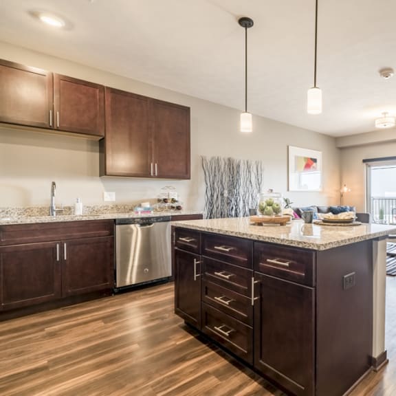 Thumbnail 6 of 13 Kitchen island providing extra cabinet space and pendant lighting at 360 at Jordan West
