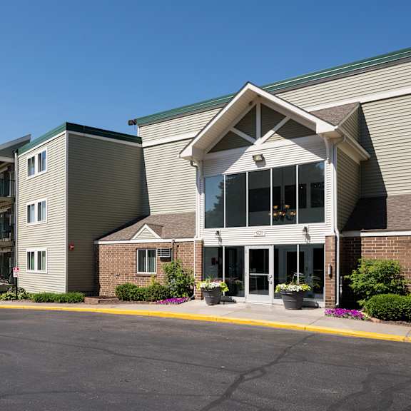 frontside view of apartment building at pheasant park apartments, new hope, mn, 55428-5401