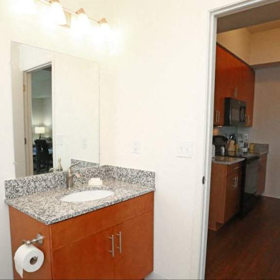 bathroom with sink and mirror  at brooks apartments, midland, michigan