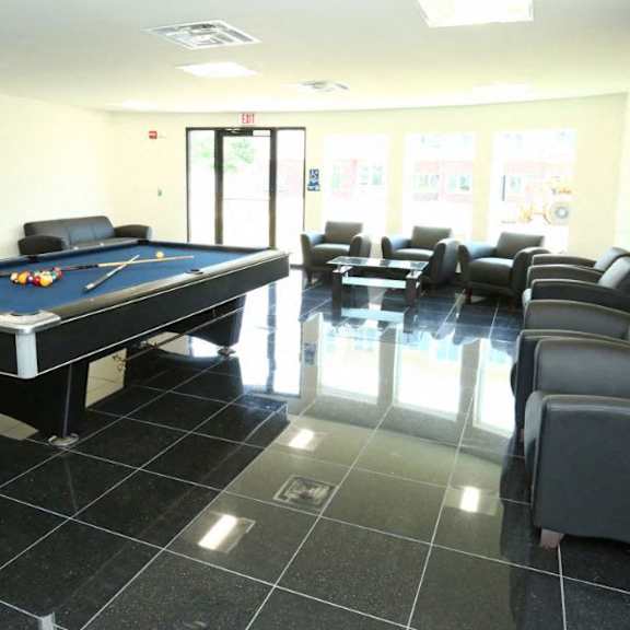 pool table with ample of sitting space  at brooks apartments, midland, mi, 48642