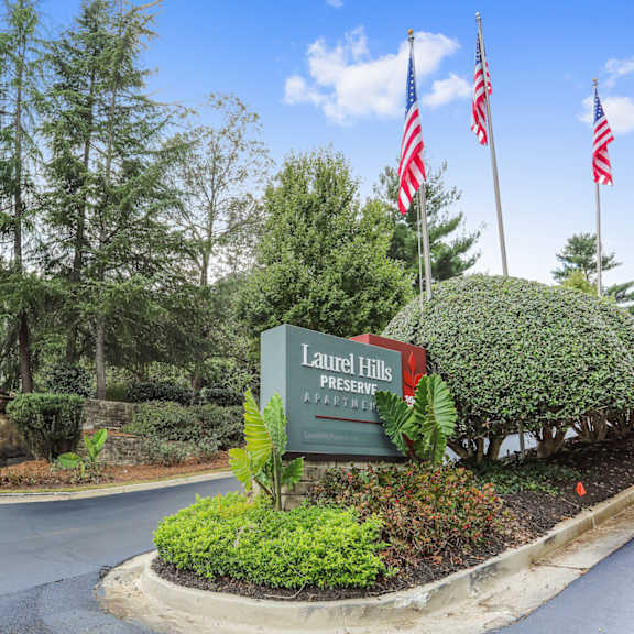 property sign with lush landscaping
