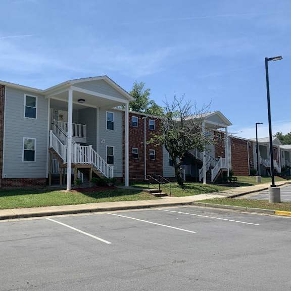 an apartment building with a parking lot