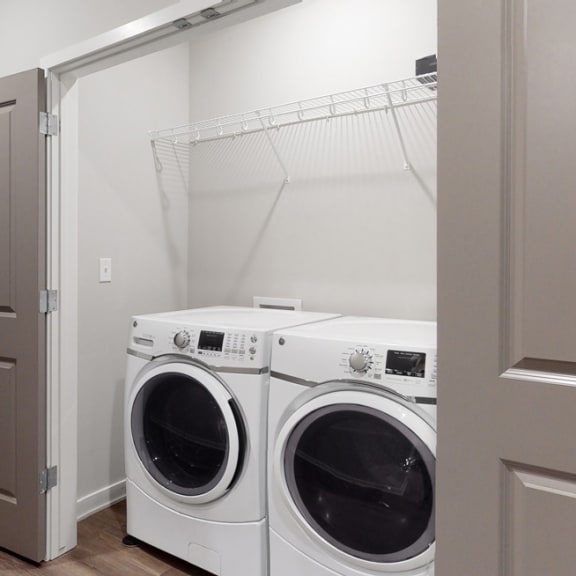 Thumbnail 20 of 28 A washer and dryer are included in the 2 bedroom Hibiscus floor plan at WH Flats