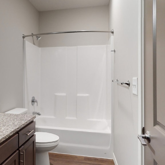 Thumbnail 22 of 28 The 2 bedroom Hibiscus floor plan features a spacious bathroom with granite vanity top and a tub/shower.