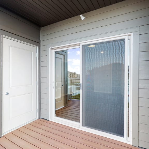 Thumbnail 7 of 19 In the Marigold with den floor plan, enjoy the view from your spacious and patio.