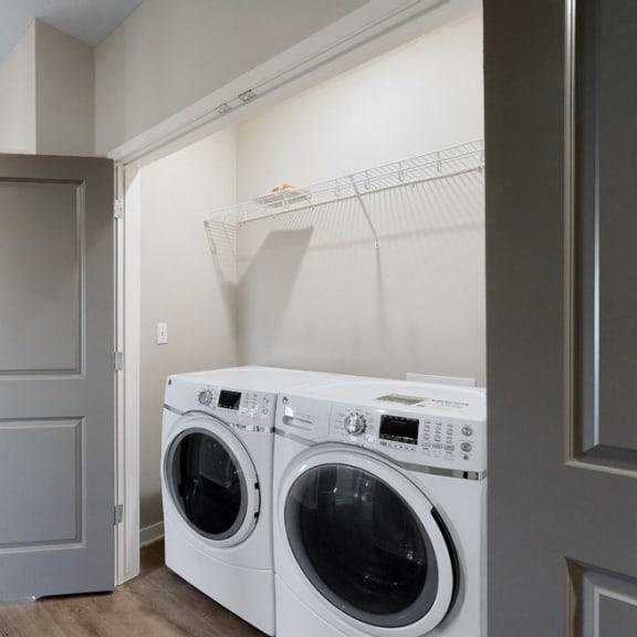 Thumbnail 10 of 19 A washer and dryer are included in the 2 bedroom Marigold with den floor plan at WH Flats
