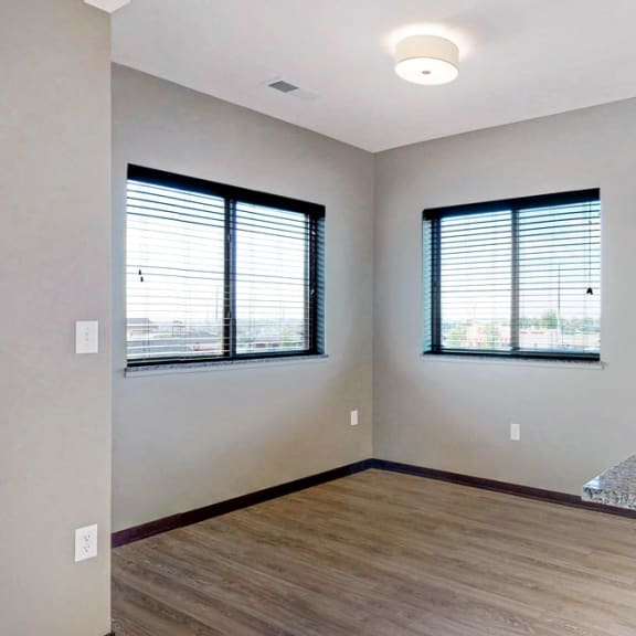 Thumbnail 12 of 24 The 2 bedroom Snowdrop with den floor plan at WH Flats features an open eat-in kitchen area with granite countertops and large peninsula.