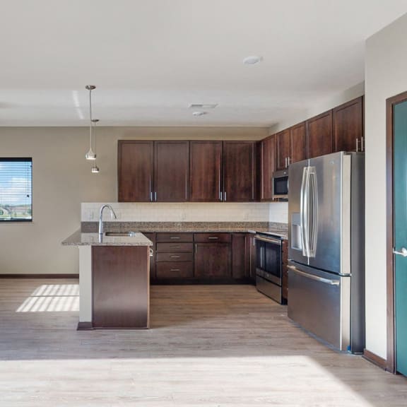 Thumbnail 14 of 24 The 2 bedroom Snowdrop with den floor plan at WH Flats features natural light and a spacious living and dining area.