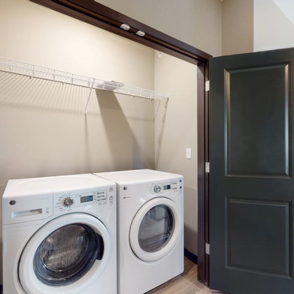 Thumbnail 15 of 24 A washer and dryer are included in the 2 bedroom Snowdrop with den floor plan at WH Flats
