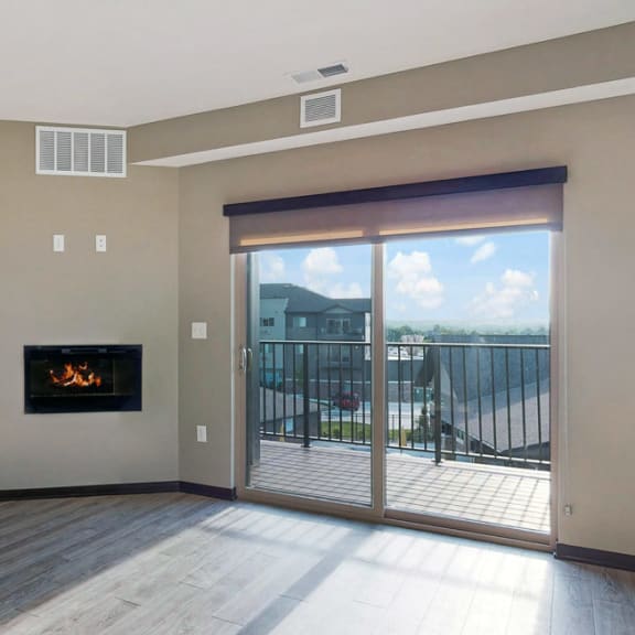 Thumbnail 17 of 24 The 2 bedroom Snowdrop with den floor plan at WH Flats features natural light and a spacious dining and living area with electric fireplace.