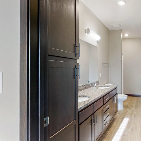 Thumbnail 19 of 24 The master bathroom in the Snowdrop with den floor plan features dual vanity with large shower.
