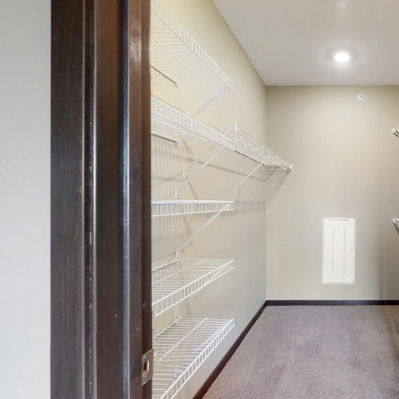 Thumbnail 23 of 24 You'll love the large walk-in closet in the master bedroom of the Snowdrop with den floor plan at WH Flats.