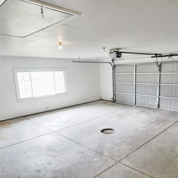 inside of the empty two car garage with the door closed