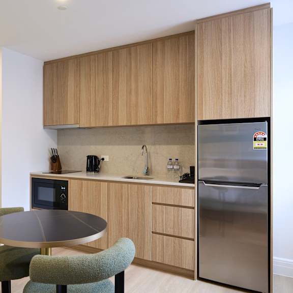 a kitchen with a table and chairs.