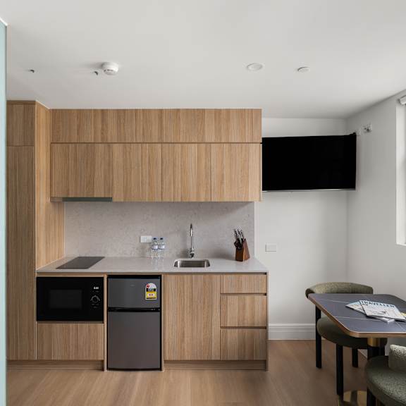 a kitchen with a table and chairs.