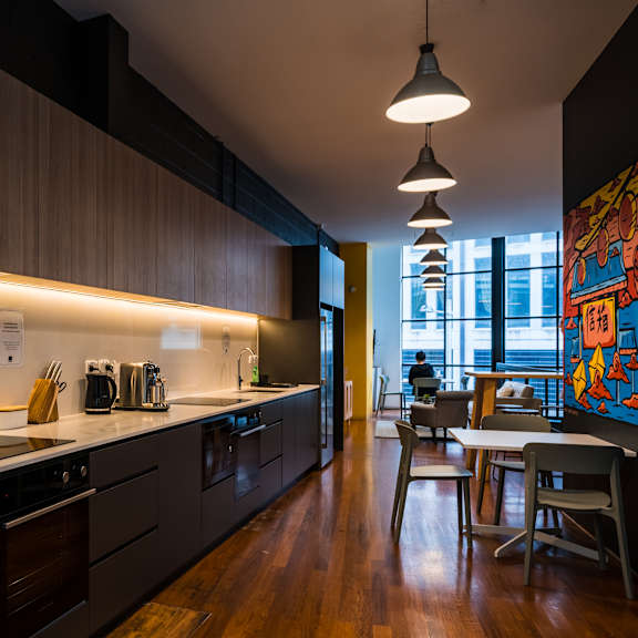 a kitchen and dining area in a modern apartment
