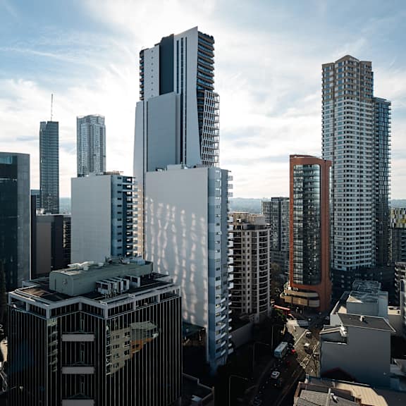 a cityscape with tall buildings and a clear sky.