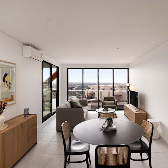 a modern dining room with a table set for four.