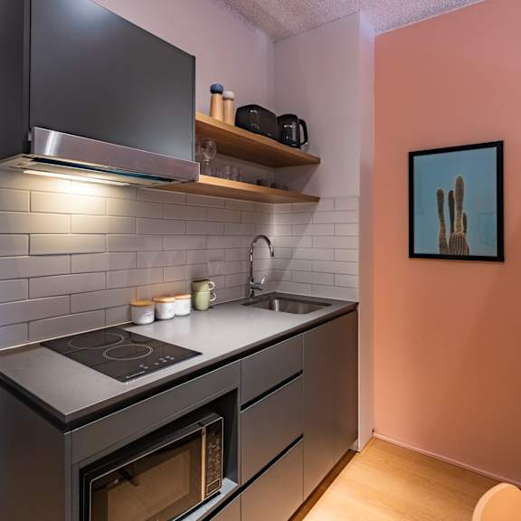 a small kitchen with a stove and a sink