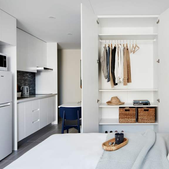 a bedroom with a bed and a closet
