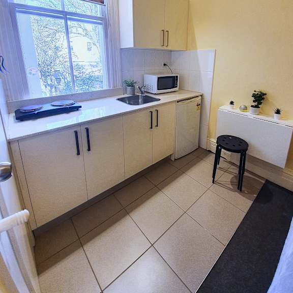 a kitchen with a sink and a window