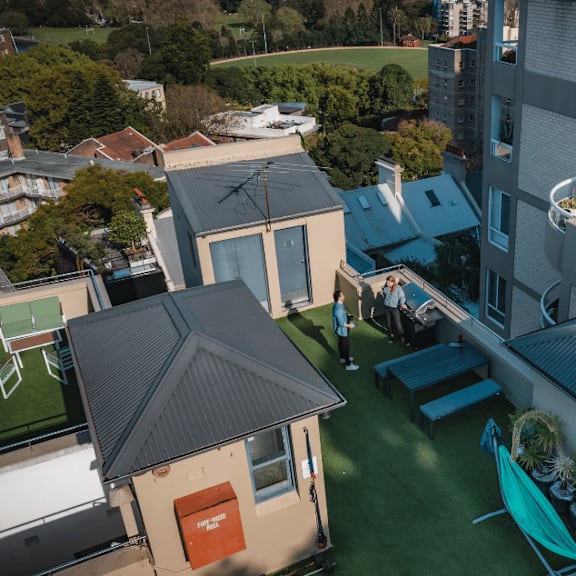 a view of the backyard of a house with a pool and a turquoise