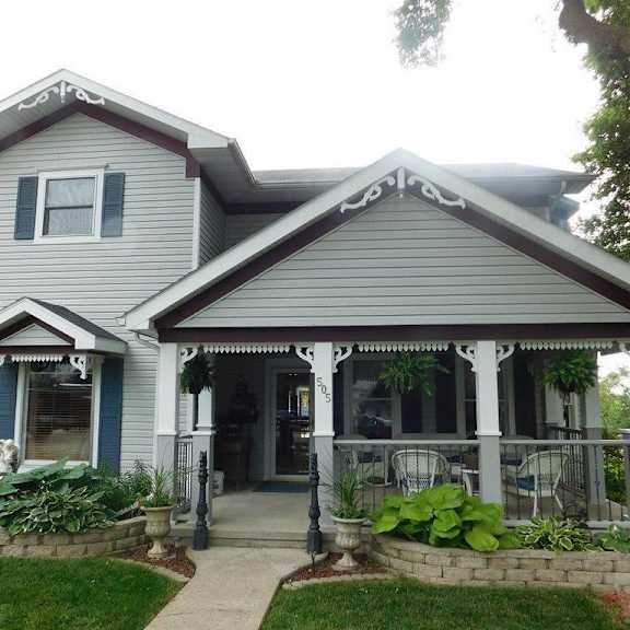 a house with a porch and a porch swing