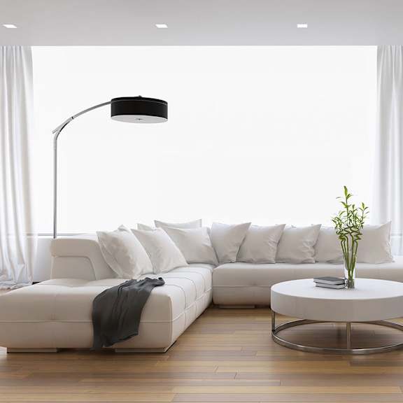a white living room with a white couch and a white coffee table