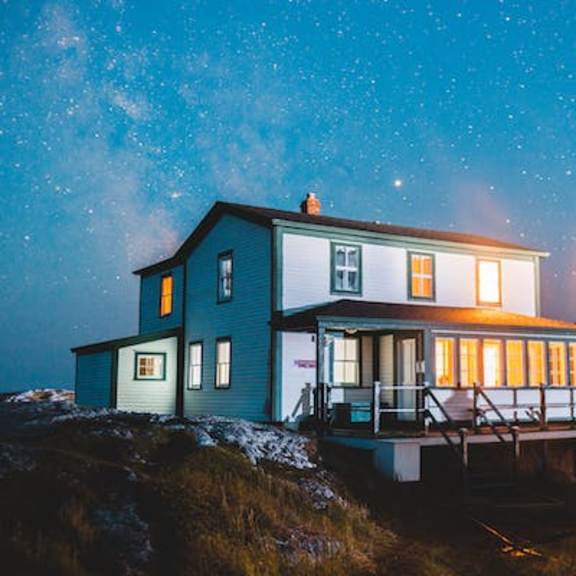 a house with the night sky in the background