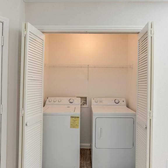 a small laundry room with a washer and dryer.