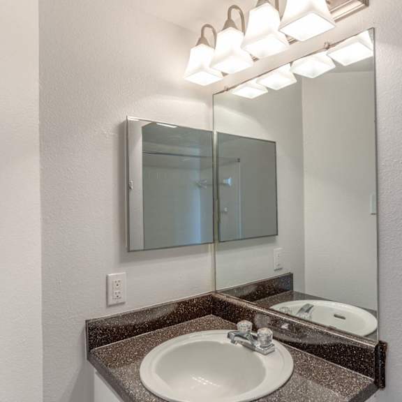 a bathroom sink with a mirror above it.