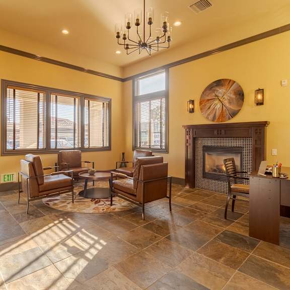 a living room with a fireplace and a couch.