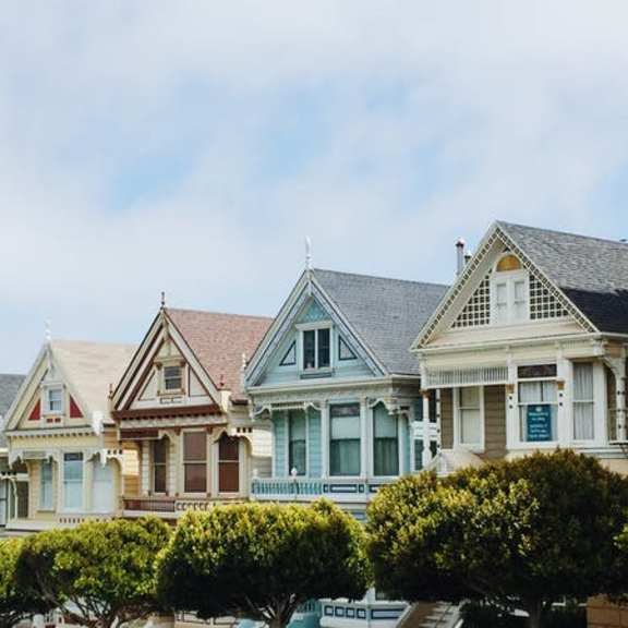 a row of colorful houses sitting next to each other