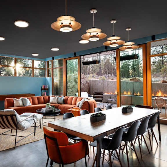 a modern dining room with a large table and chairs.