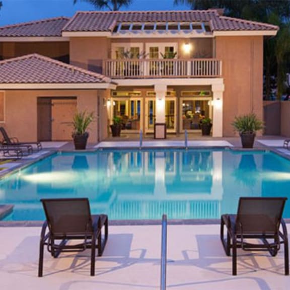a swimming pool in front of a house
