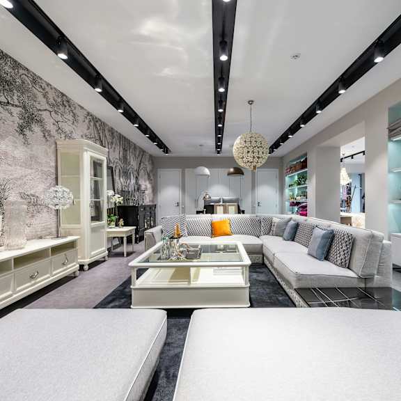 a modern living room with a large sofa and a coffee table.