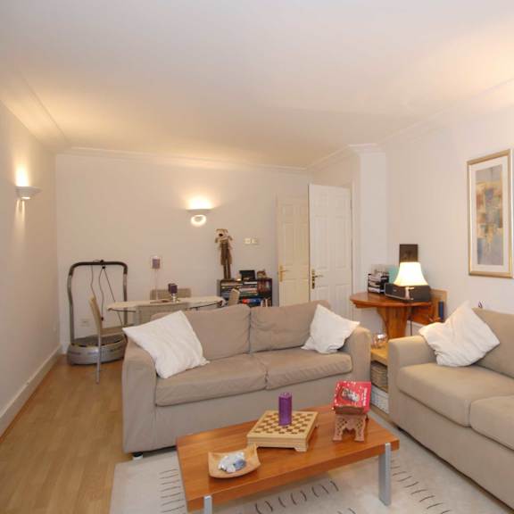 a living room with two couches and a coffee table.