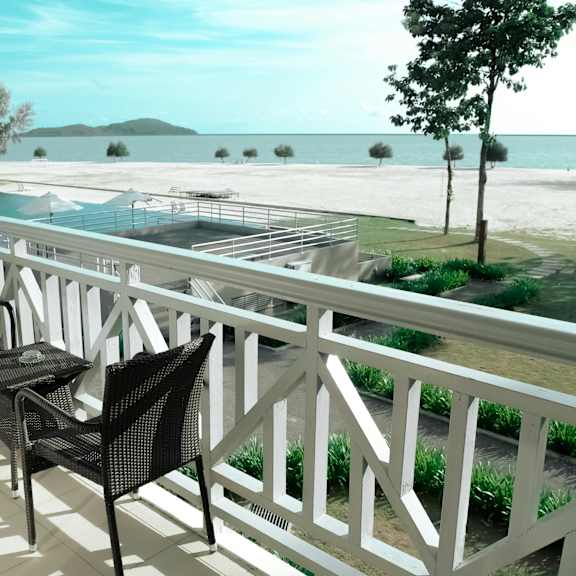 a white railing with chairs and tables on it.