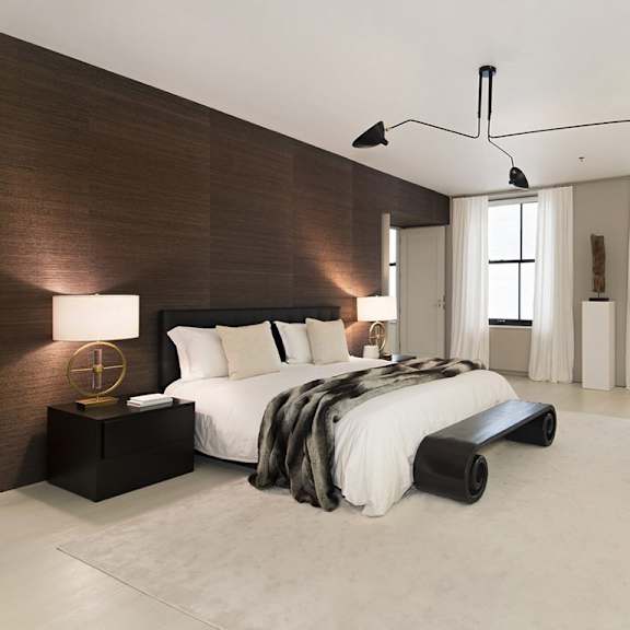 a modern bedroom with a large bed and a chair.