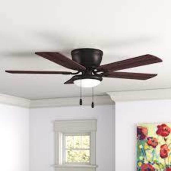 a ceiling fan with a light hanging from the ceiling in a room with a window and a painting on the wall.