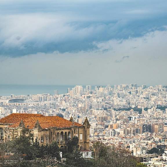 a cityscape with a prominent building in the foreground.