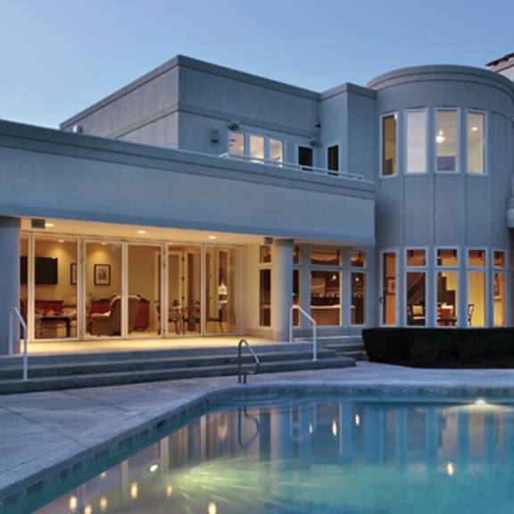 a modern house with a pool in the backyard.