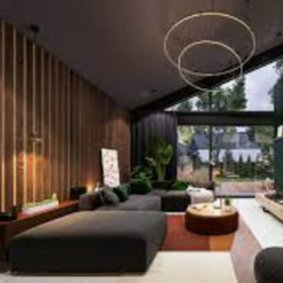 a modern living room with a fireplace and a large couch.