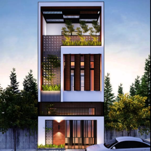a modern two-story house with a white car parked in front.