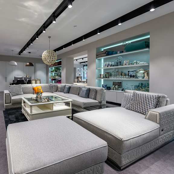 a modern furniture store with a variety of seating options.