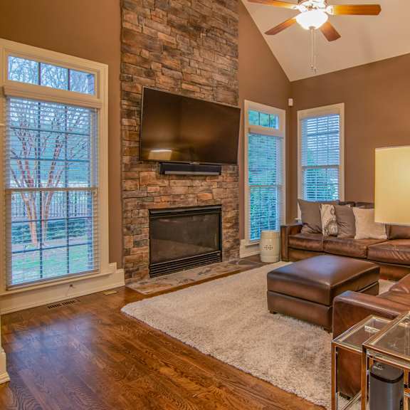 a living room with a fireplace and a couch.