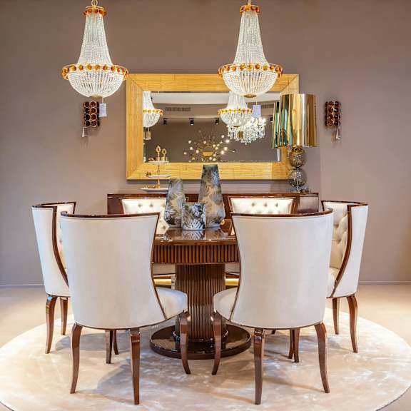 a dining room with a large table and chairs.