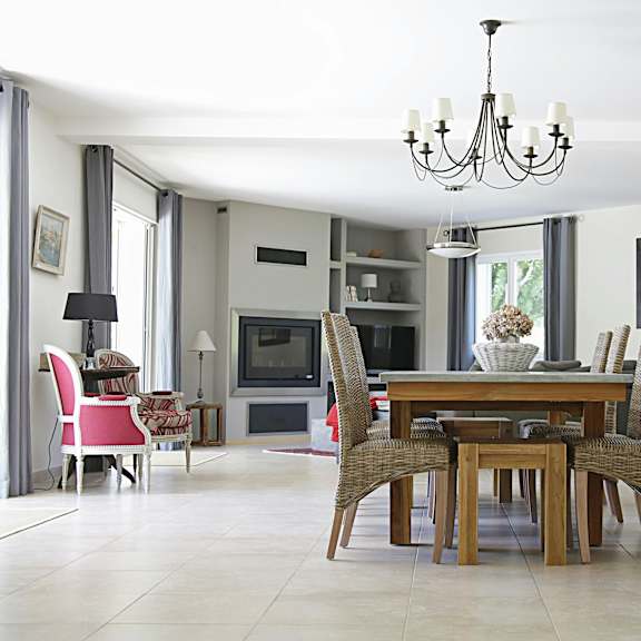 a dining room with a wooden table and chairs.