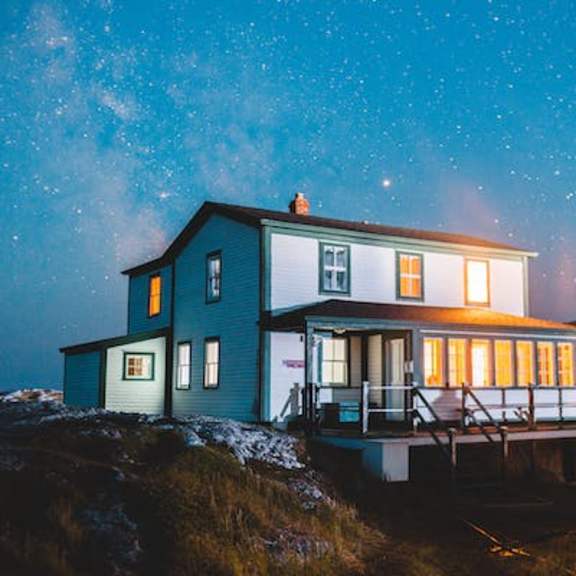a house with the night sky in the background