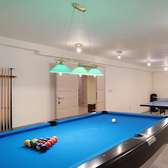 game room with billboard and table tennis